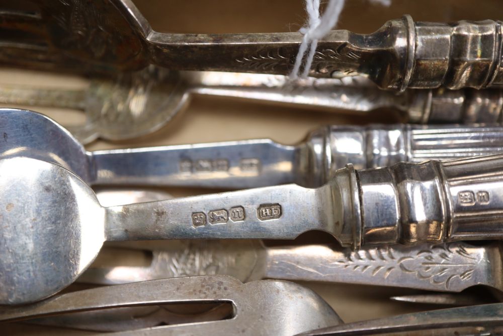 A set of twelve pairs of Edwardian silver fish eaters by Harrison Fisher, Sheffield, 1905 (loaded handles).